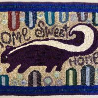 Skunk's Welcome, pattern by Primitive Grace, 16 1/2" x 30"
