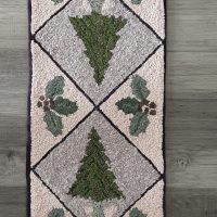 The Holly and Pine Tree Sampler Table Runner, 11 1/2" x 45 1/2" by Joan Moshimer